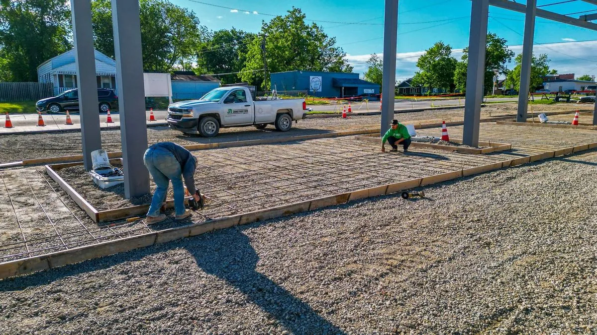 Construction crew tying rebar for concrete foundation
